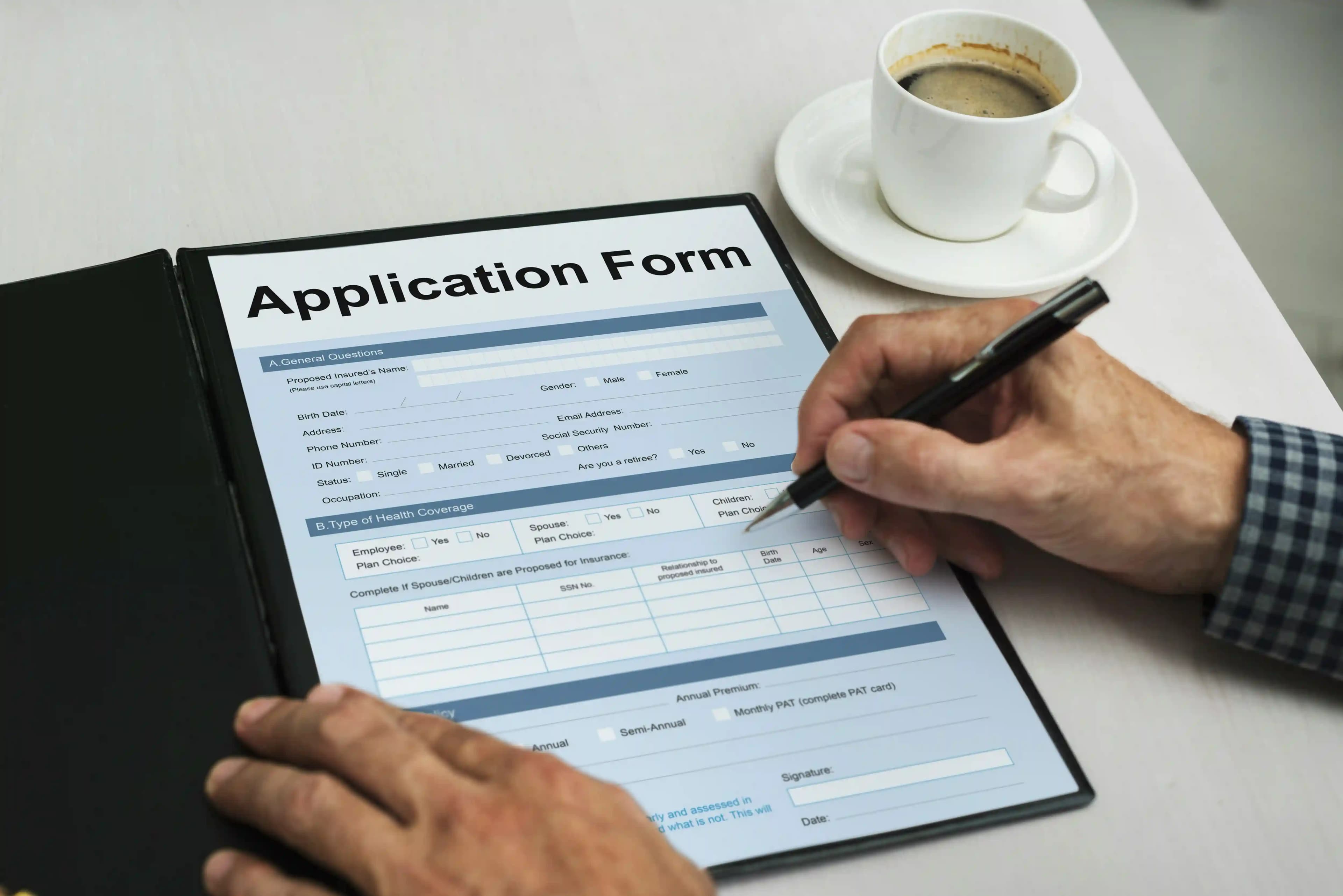 A person filling in an application form