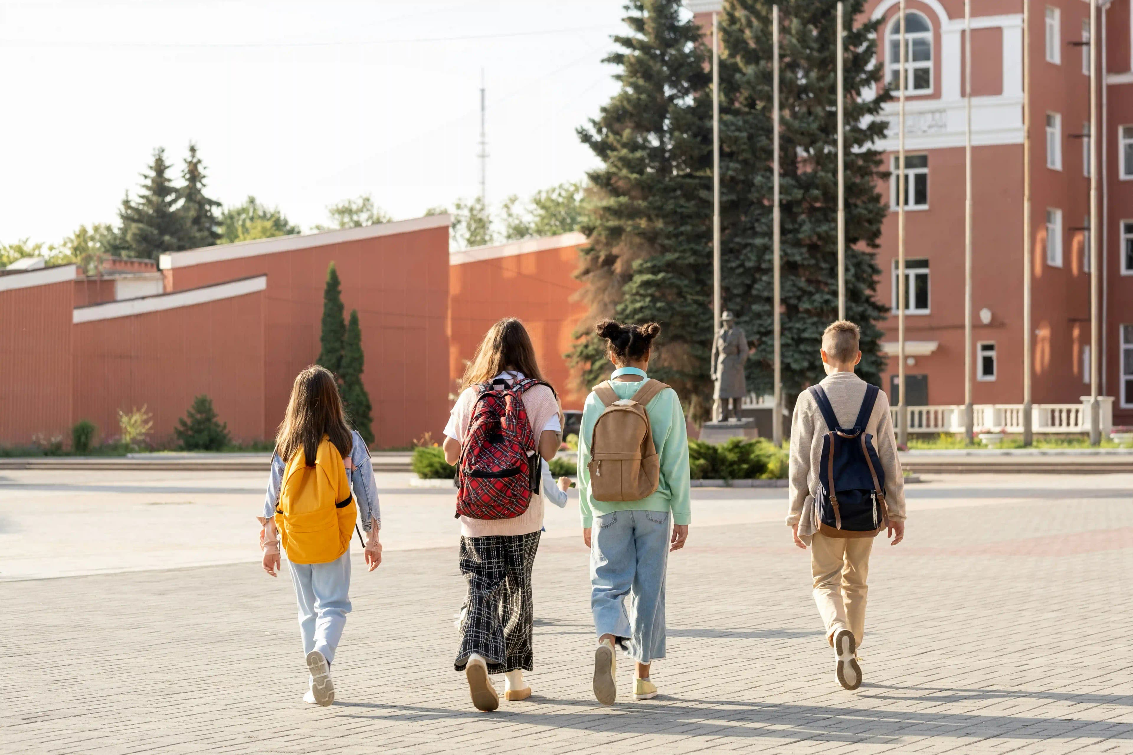 Students walking across a university campus