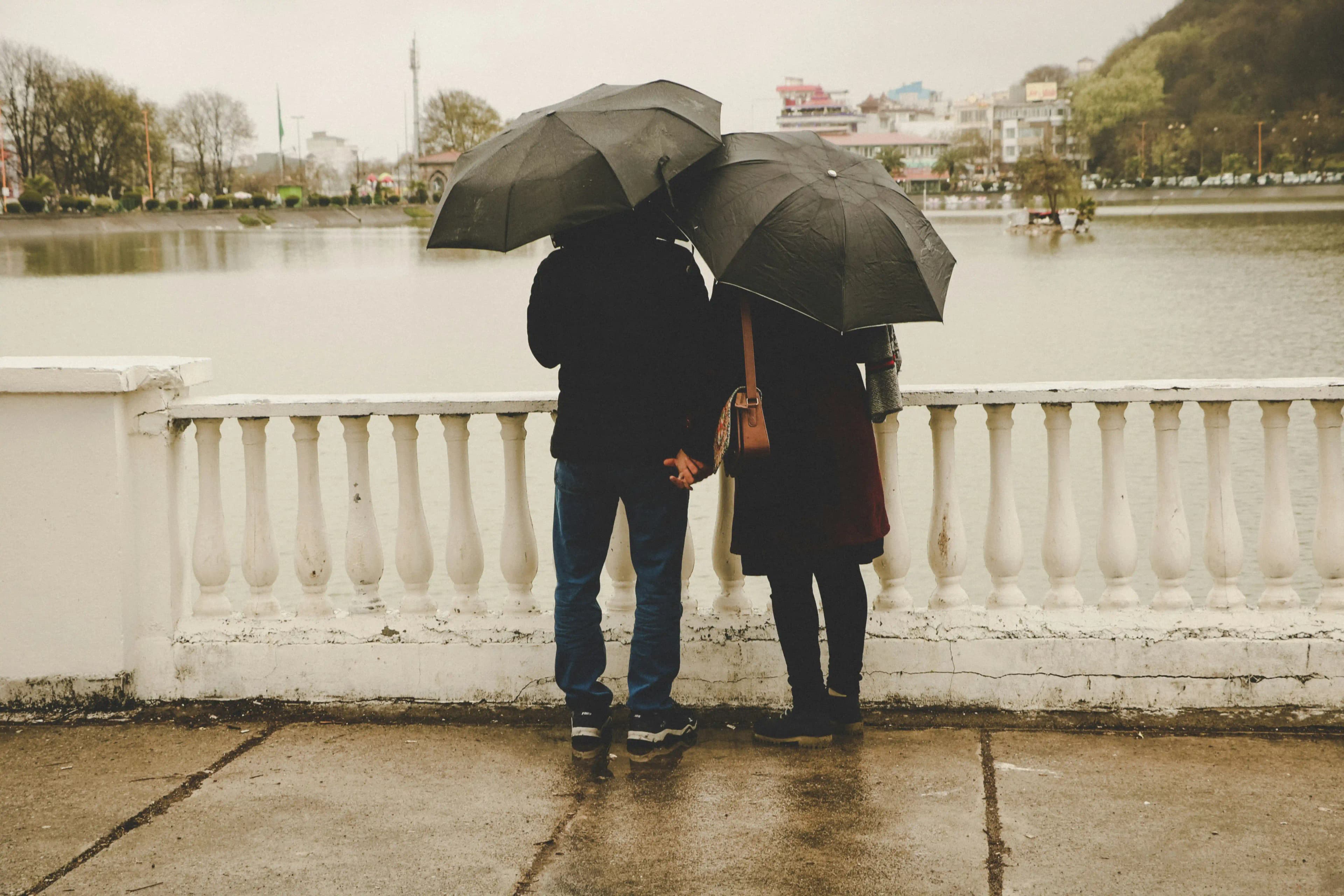 A couple looking out over a waterfront