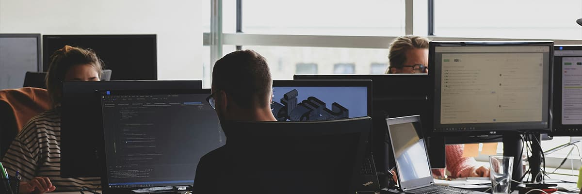 A professional working at a computer